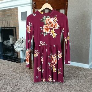 Burgundy dress with floral design.